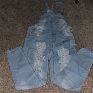 ripped light wash overalls